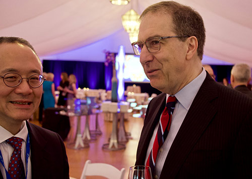 Two men in business suits talking